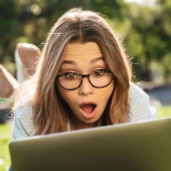 woman shocked laptop in the park