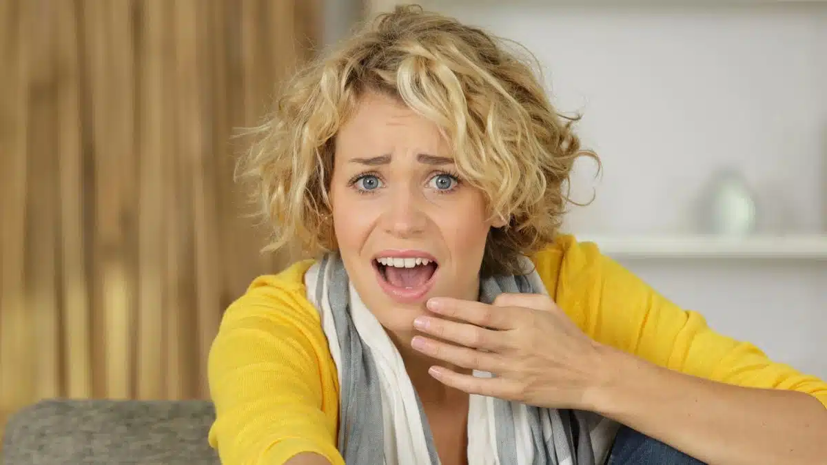 woman shocked watching tv