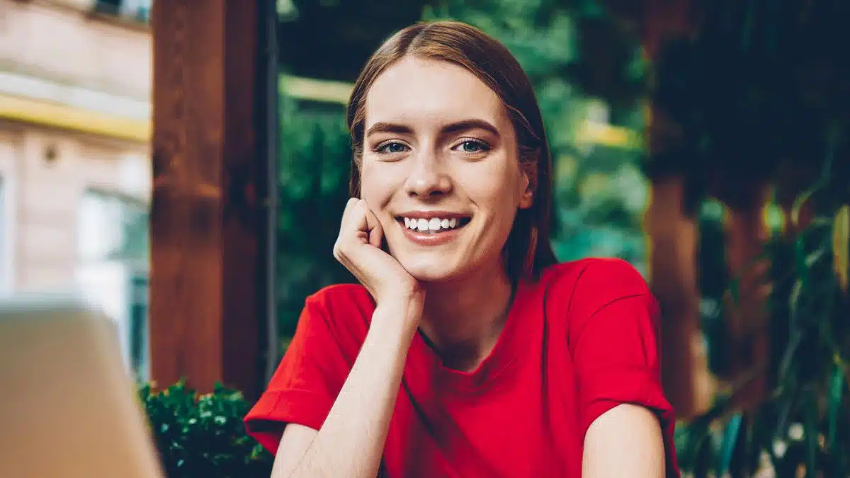 woman sitting a table thinking