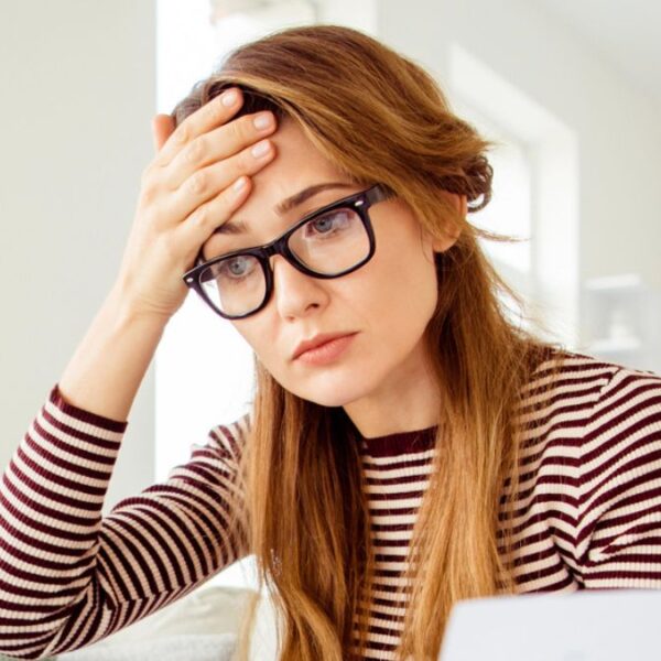 woman stressed with glasses