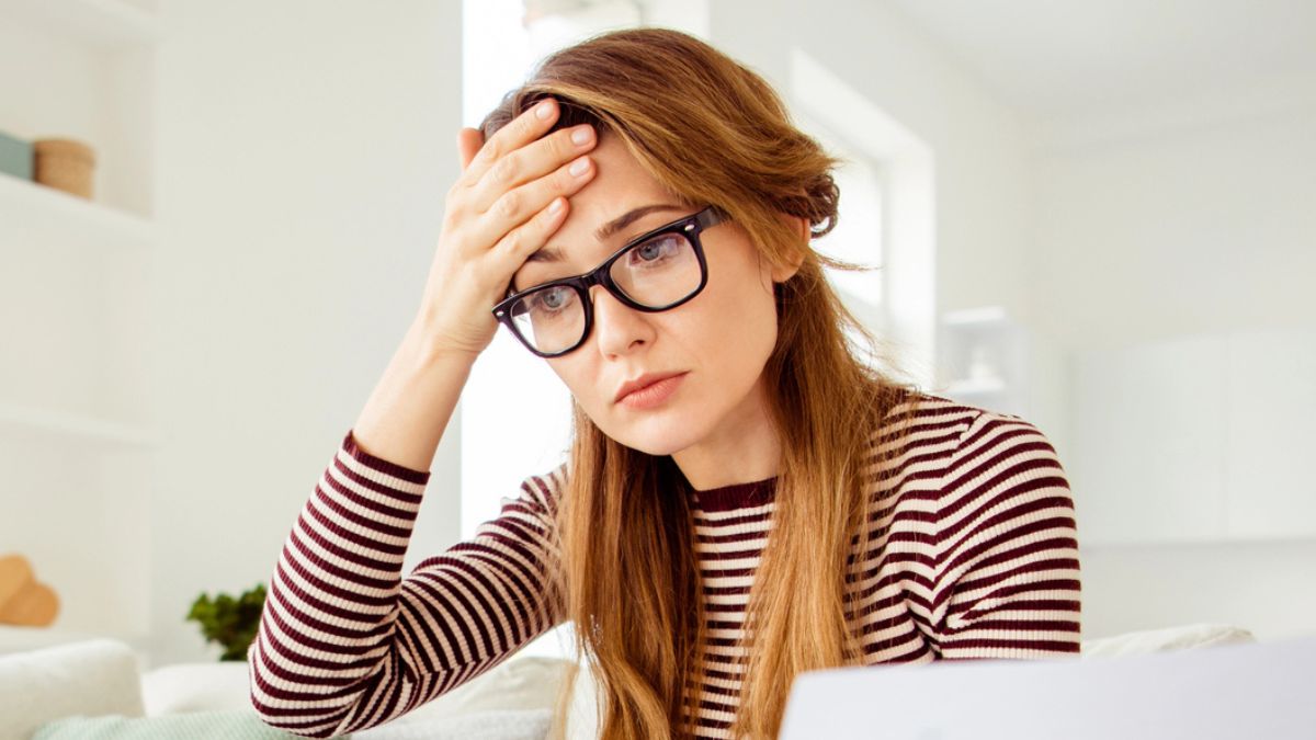 woman stressed with glasses