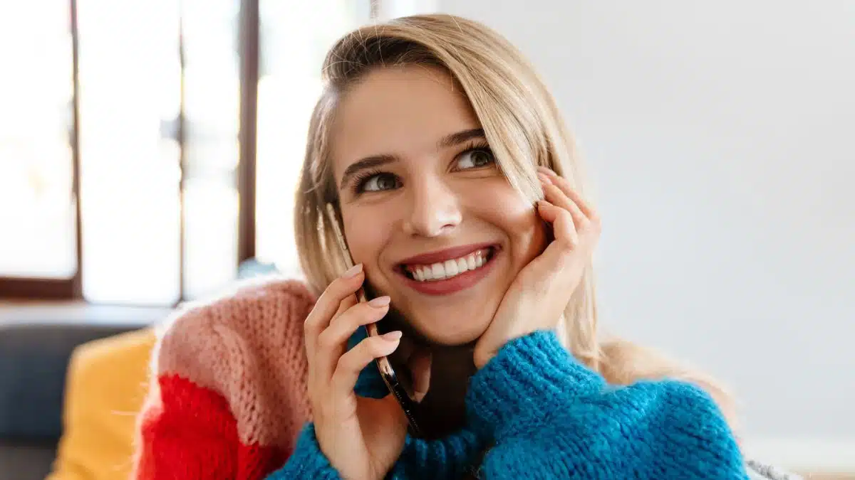 woman sweater and the phone