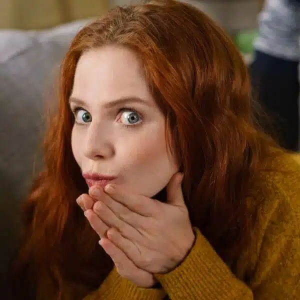 woman thinking laying on the couch