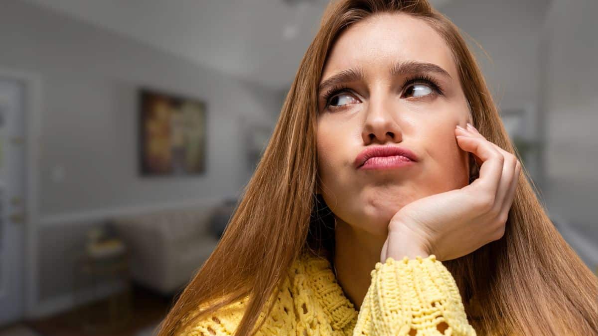 woman thinking regret at home