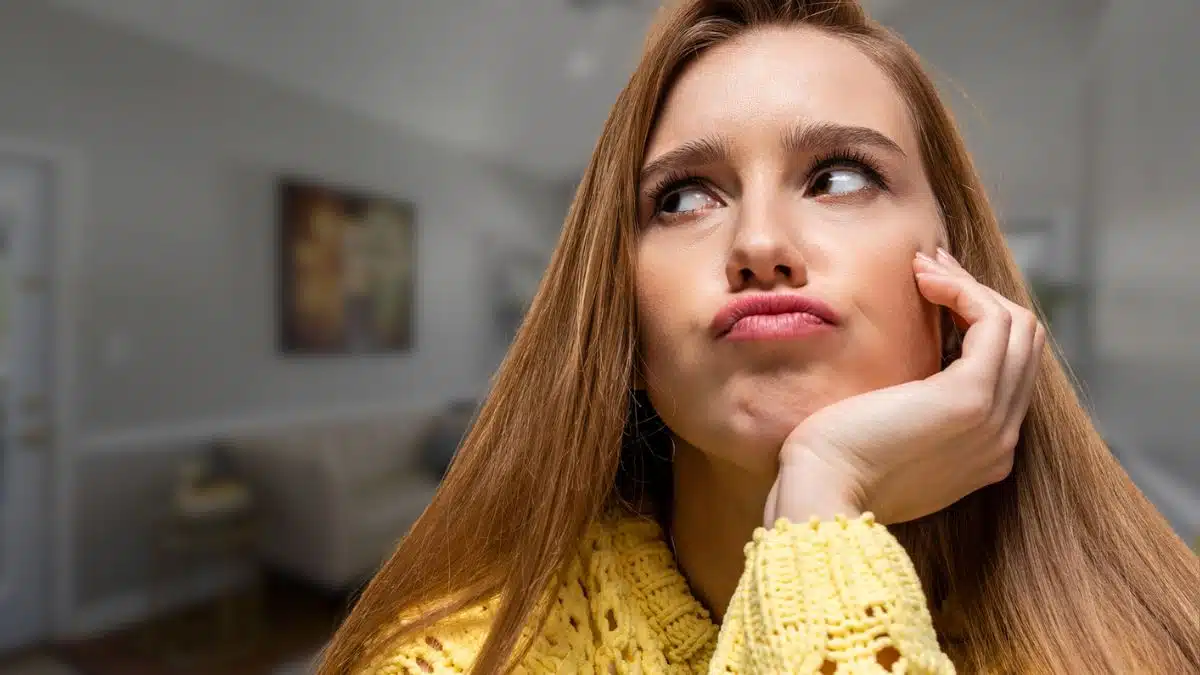 woman thinking regret at home