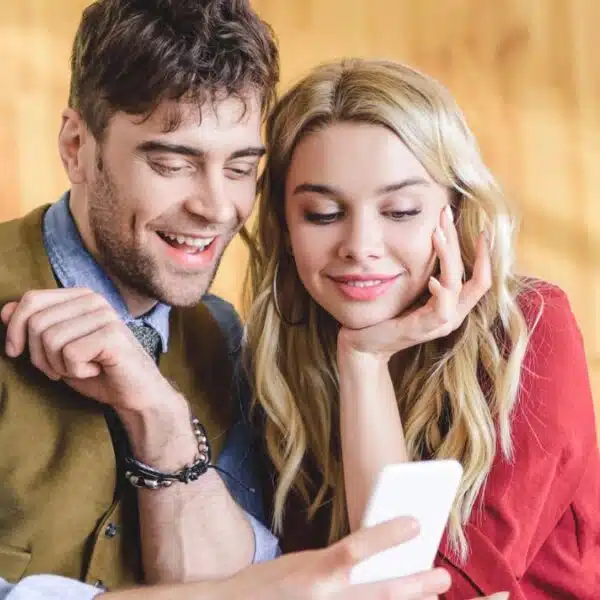 Couple reviewing their finances on their phone