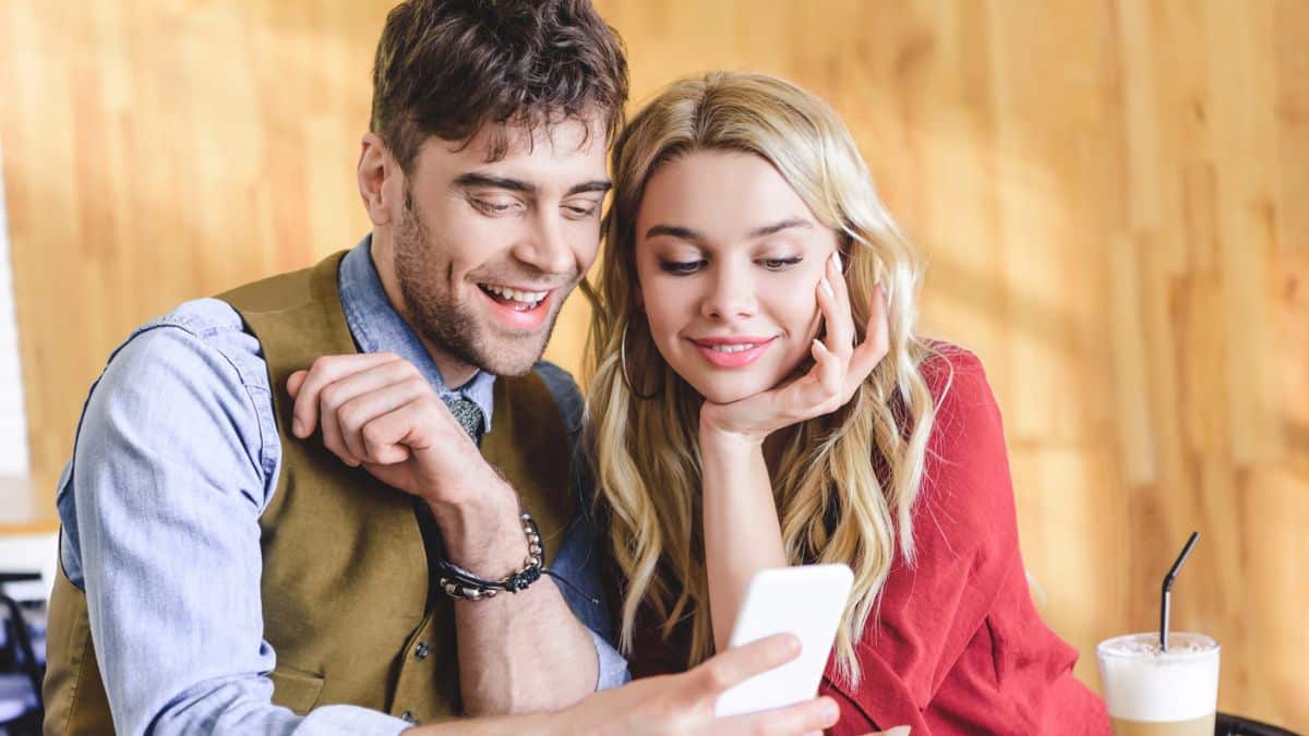 Couple reviewing their finances on their phone