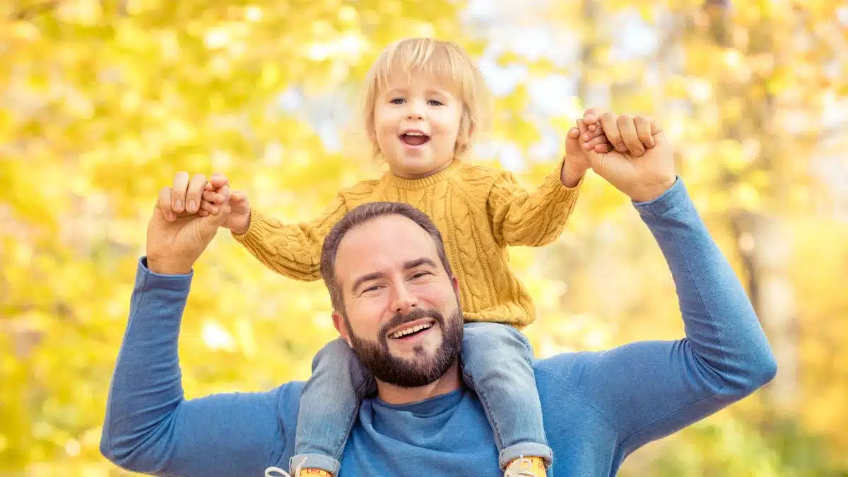 Father carrying his child outside