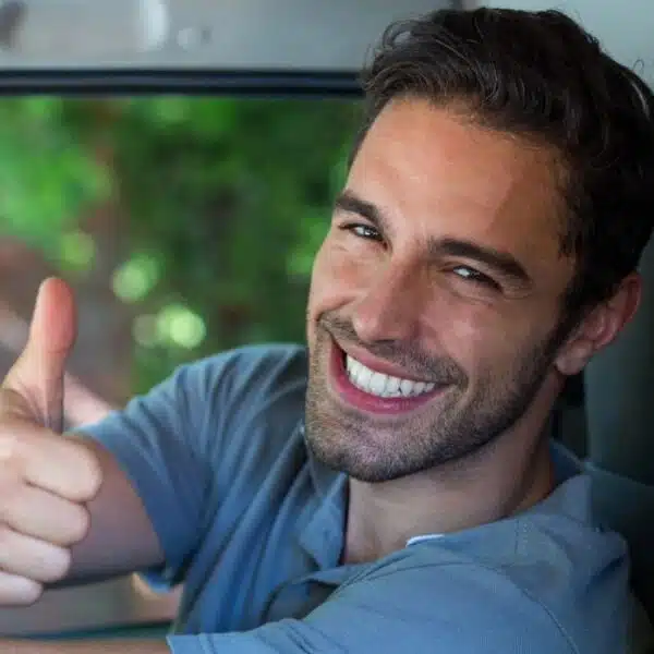 Man driving a car with payments