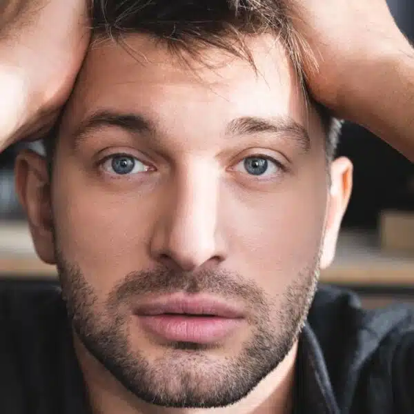 Man overwhelmed by money stress