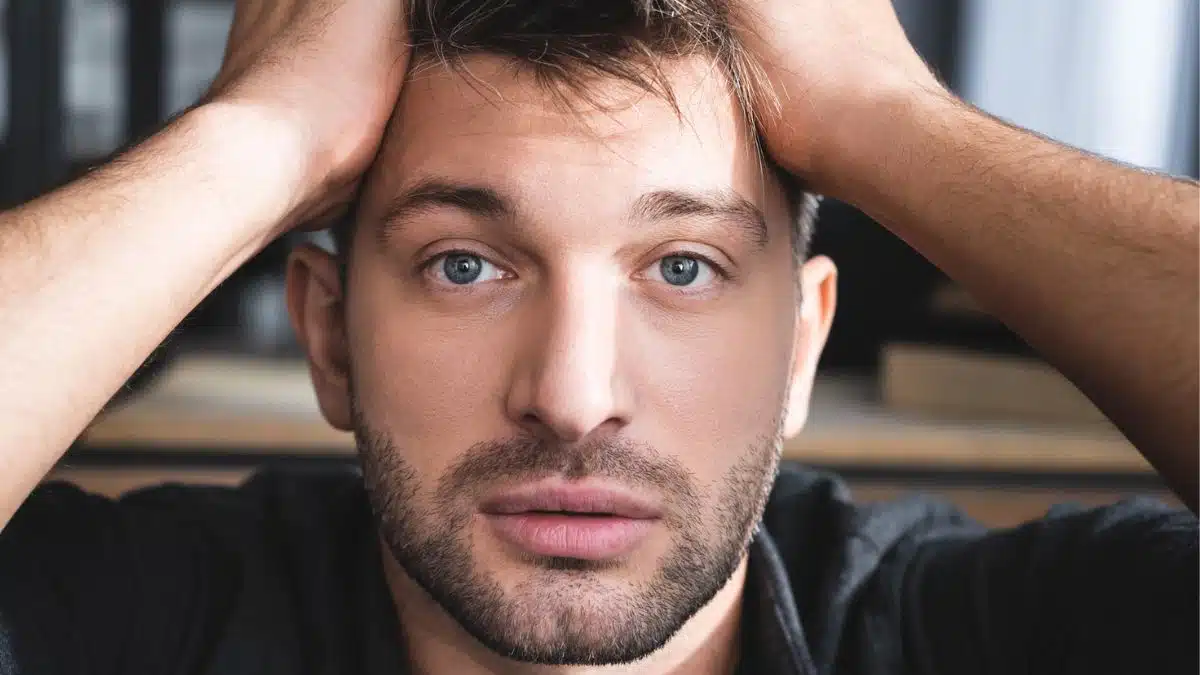 Man overwhelmed by money stress