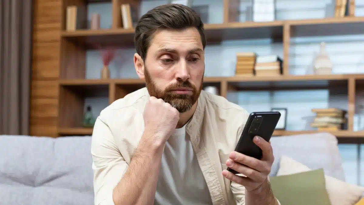 Man reviewing his low balance bank account