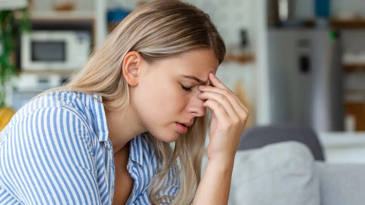 Woman feeling overwhelmed with her financial struggles