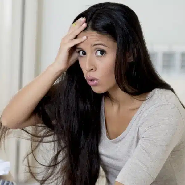 Woman overwhelmed by her bills
