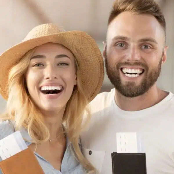 couple holding their tickets and wallets