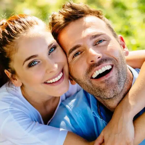 couple smiling in the grass