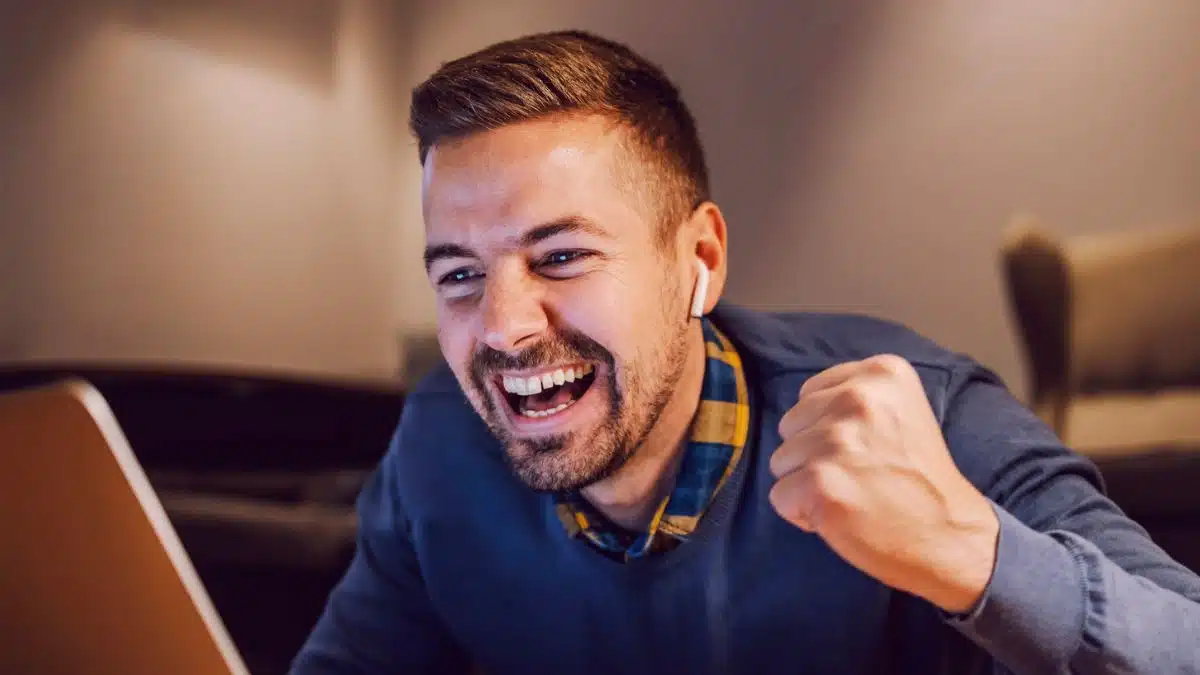 man excited on his laptop