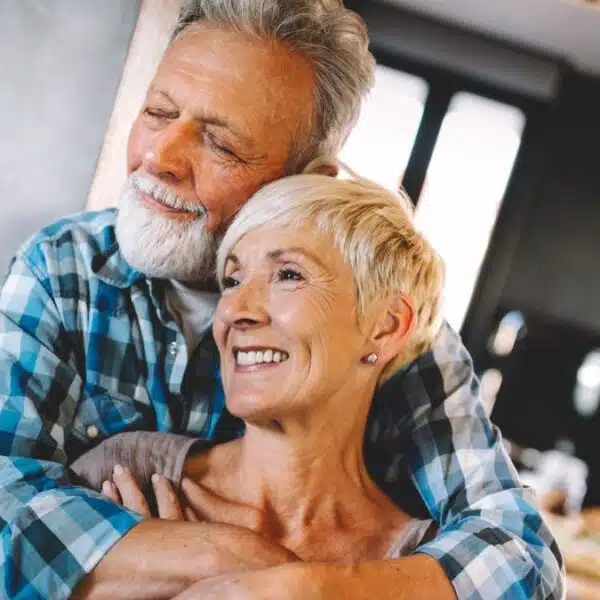 mature couple hugging one another
