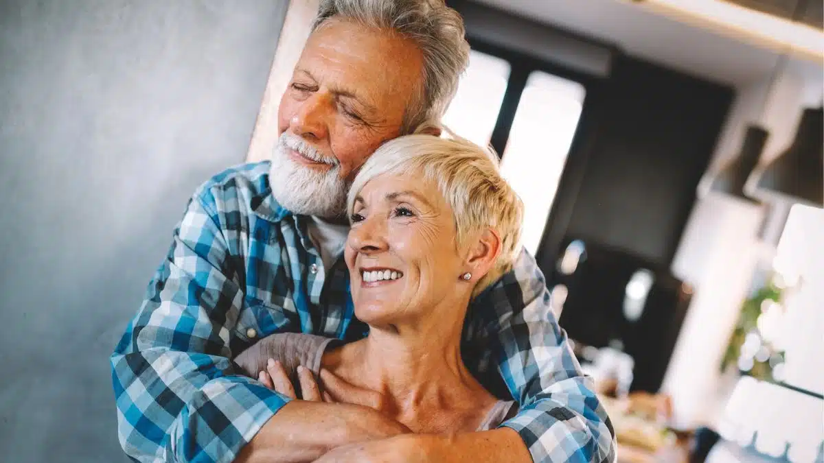 mature couple hugging one another