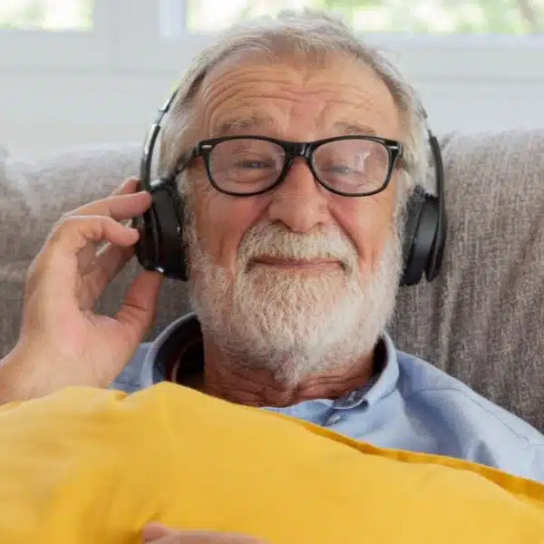 mature man with glasses and headphones