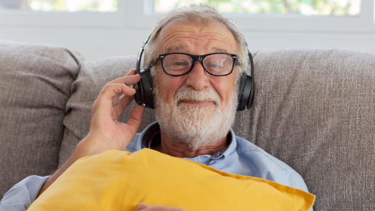mature man with glasses and headphones