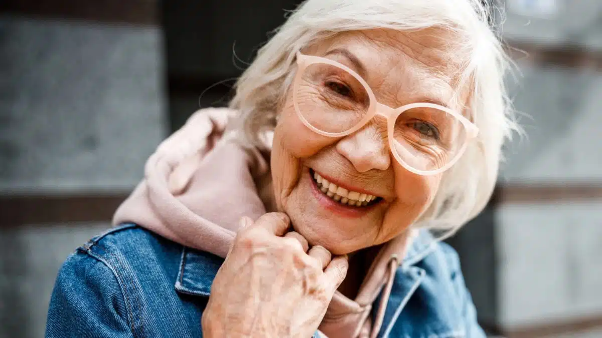 senior woman jean jacket and glasses