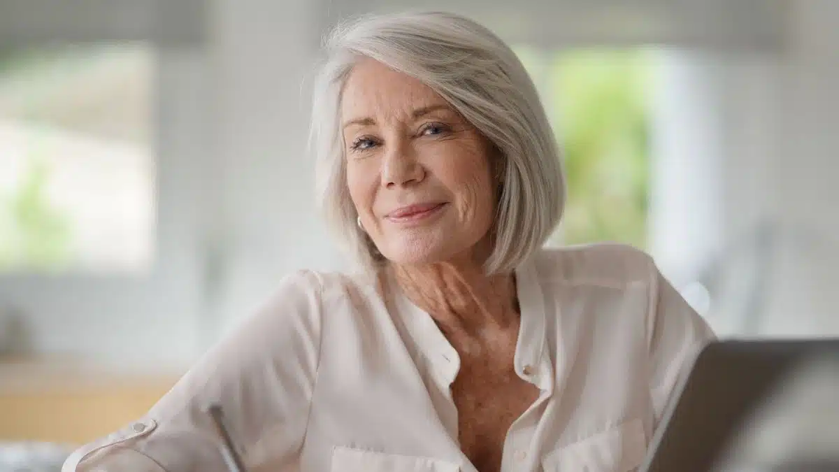 senior woman sitting at home working