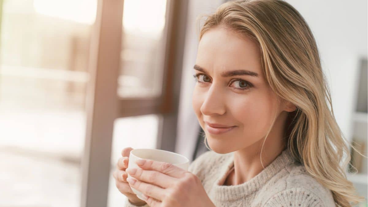 woman drinking coffee at her house