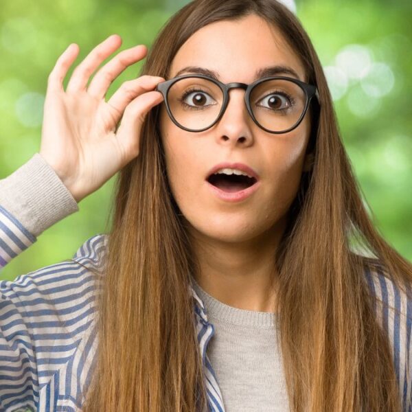 woman with glasses amazed