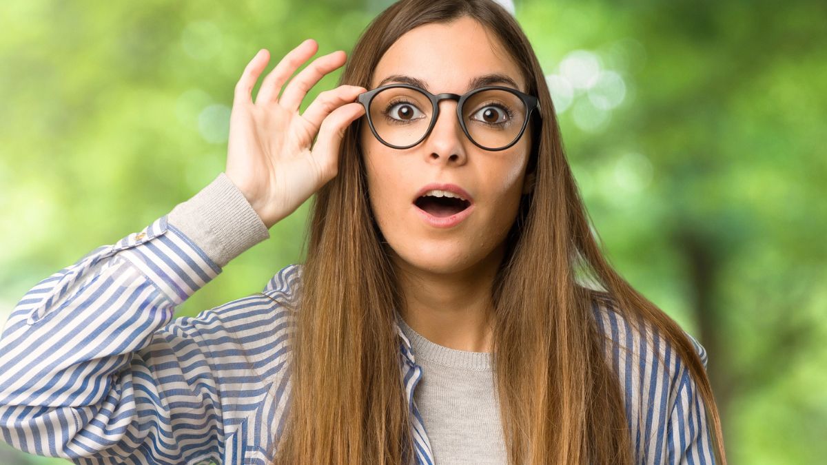 woman with glasses amazed