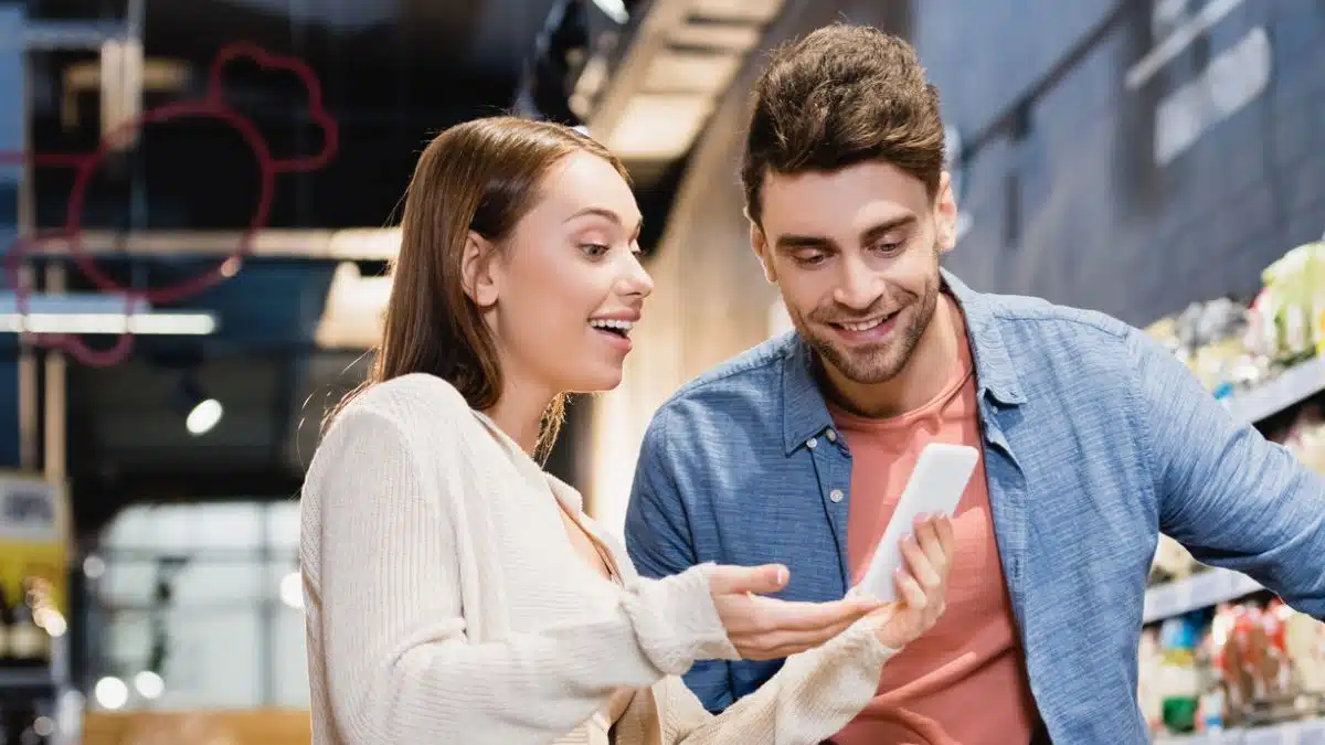 Couple reviewing grocery prices