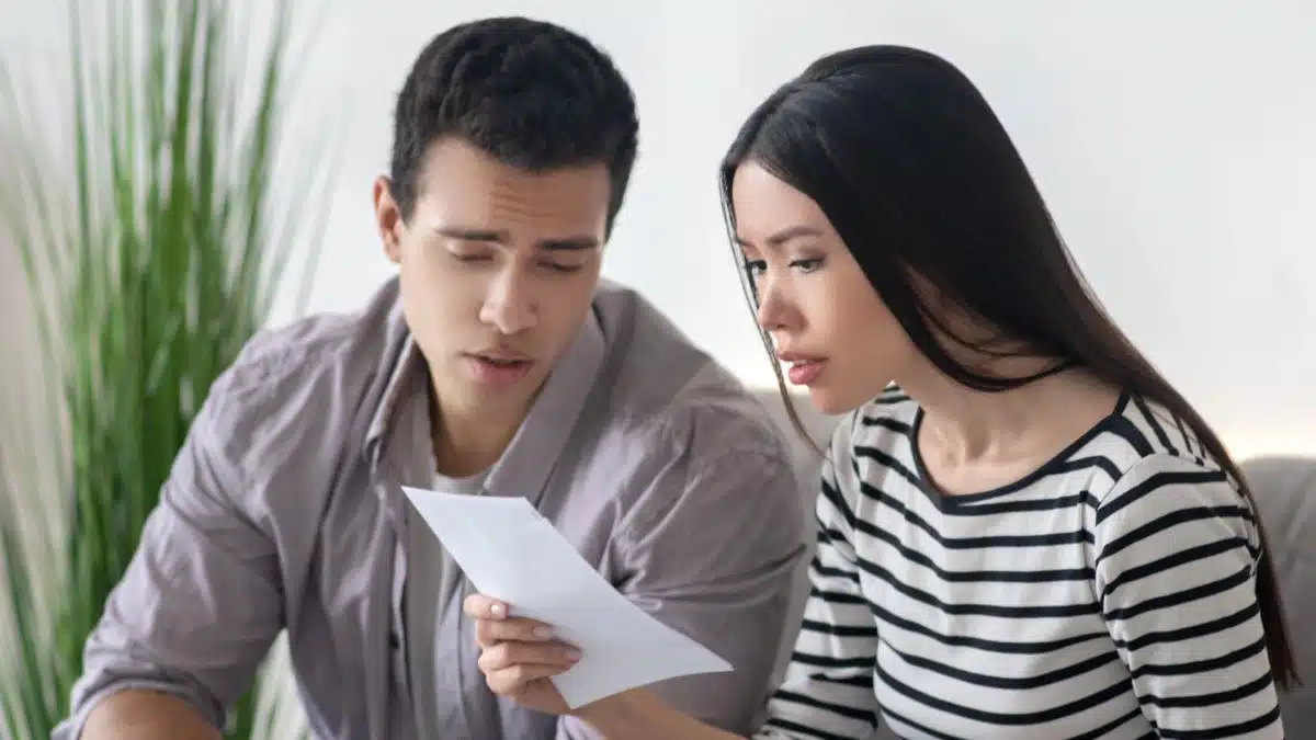 Couple stressed over their bank statements