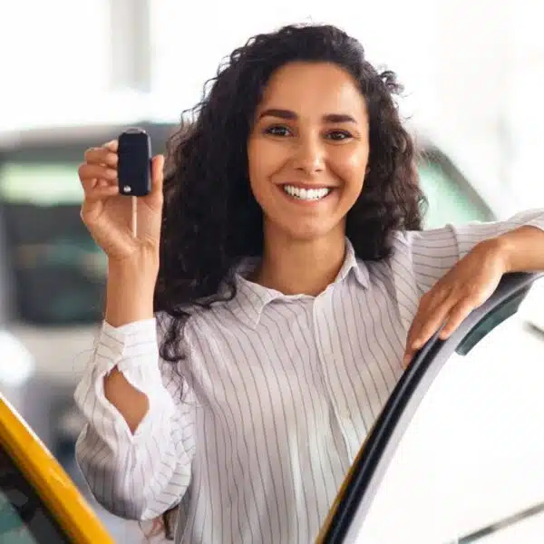 Woman driving a new car