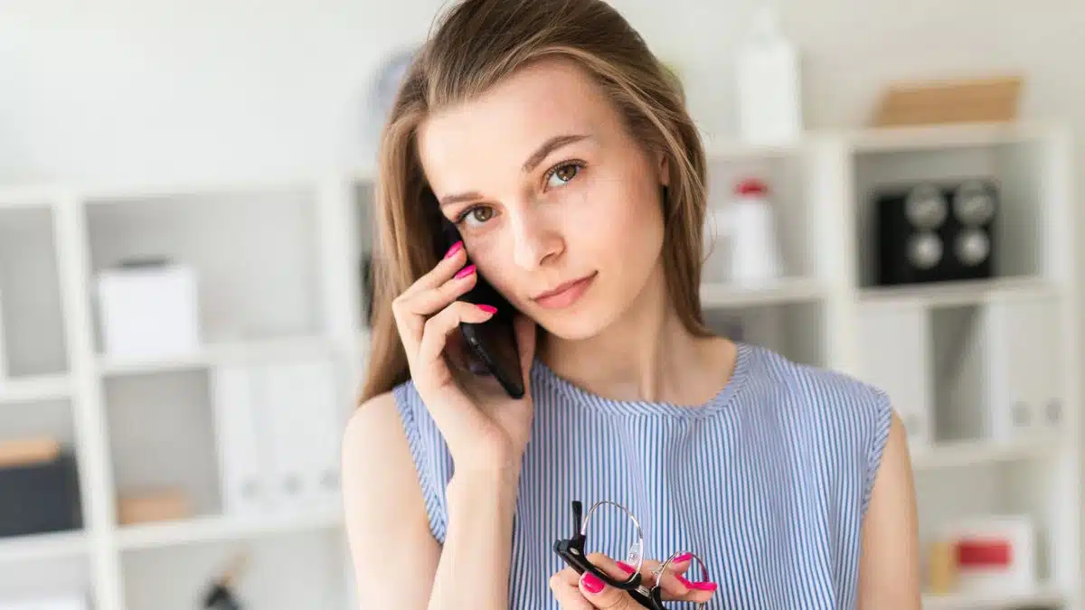 Woman making a phone call to the bank