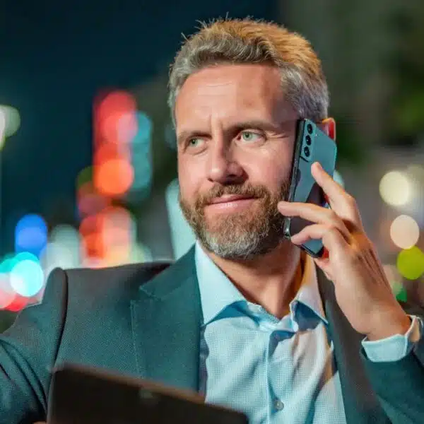 business man making a phone call outside