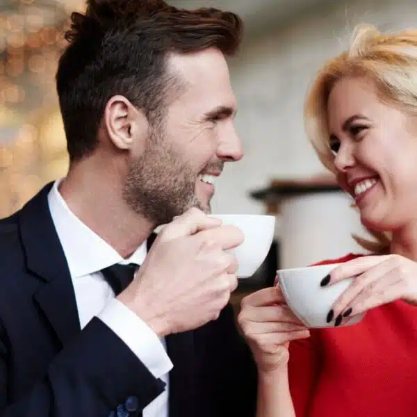 couple laughing with coffee