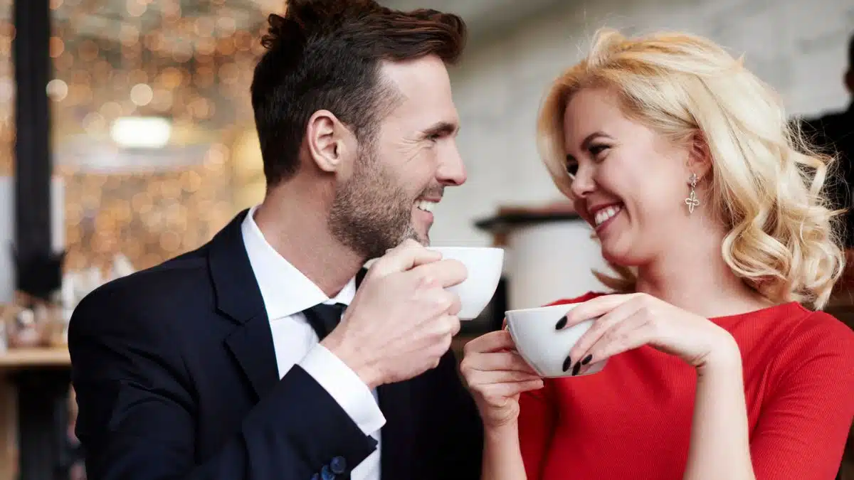 couple laughing with coffee
