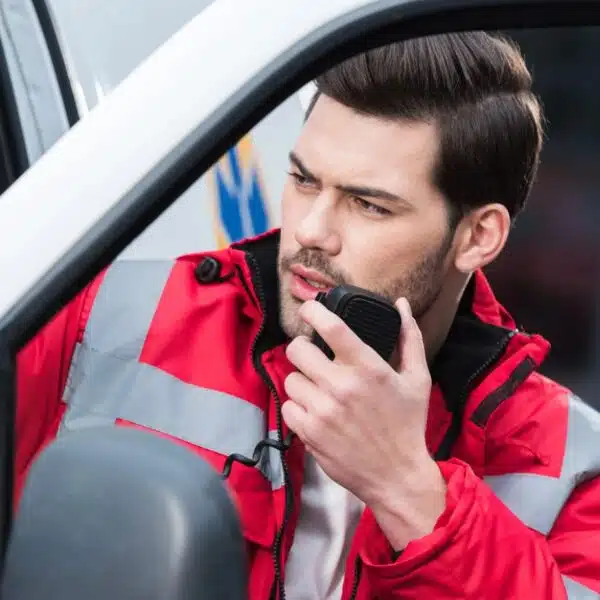 emt making a call on his walkie