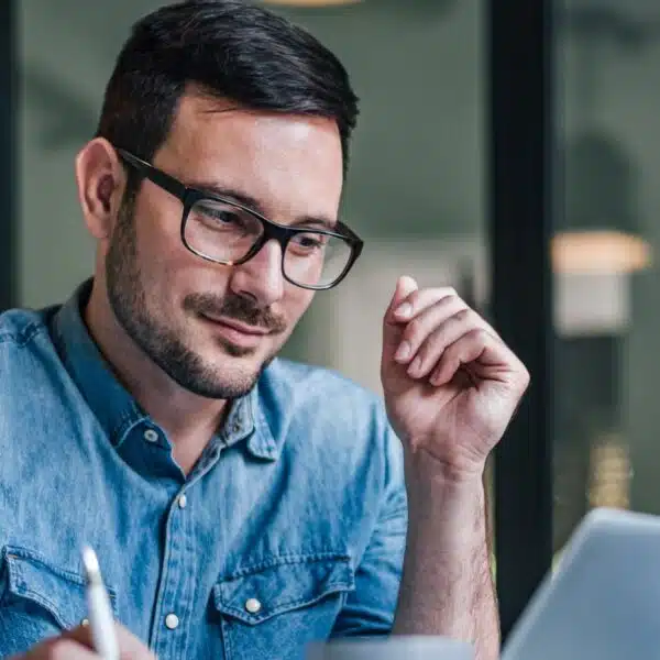 man glasses working office