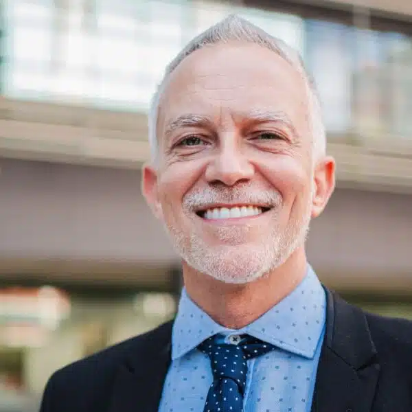 man in suit standing outside
