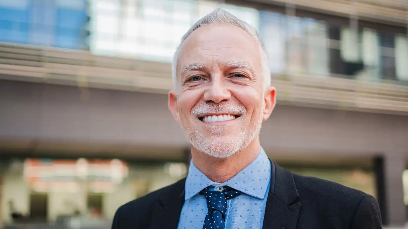 man in suit standing outside