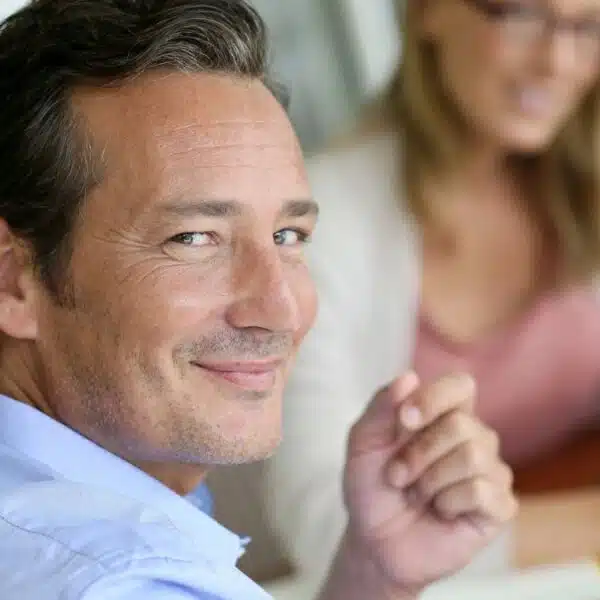 man looking over his shoulder for success