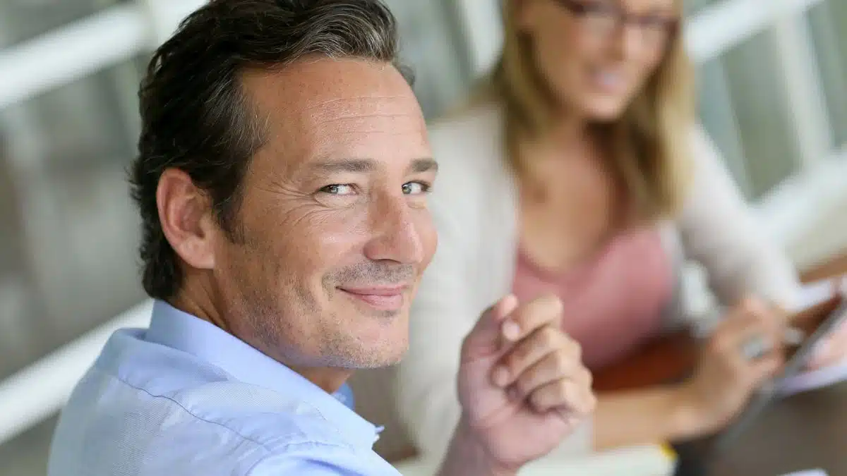 man looking over his shoulder for success