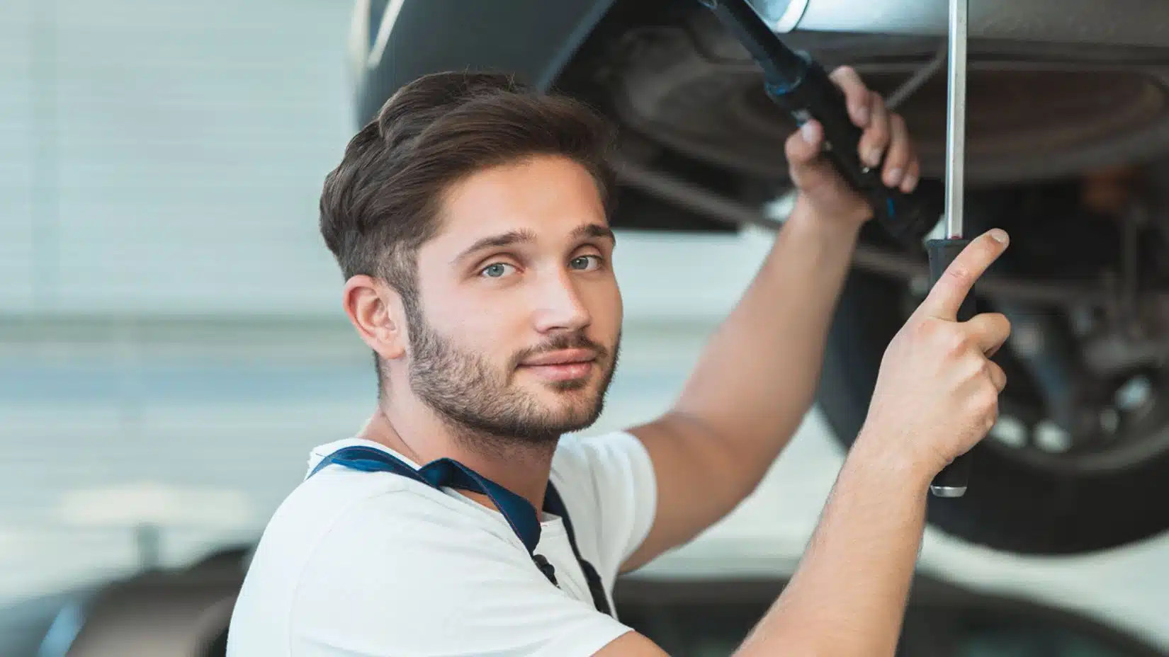 mechanic working on a car