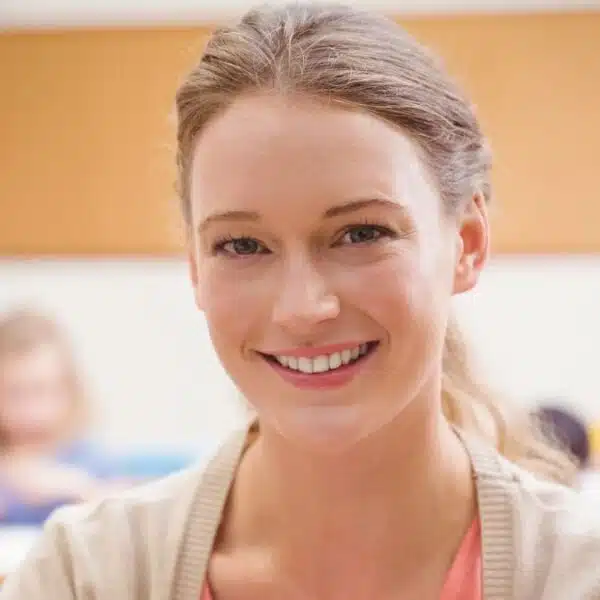 teacher smiling in classroom