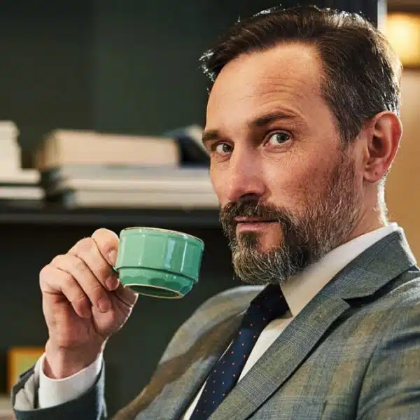 wealthy man hold coffee