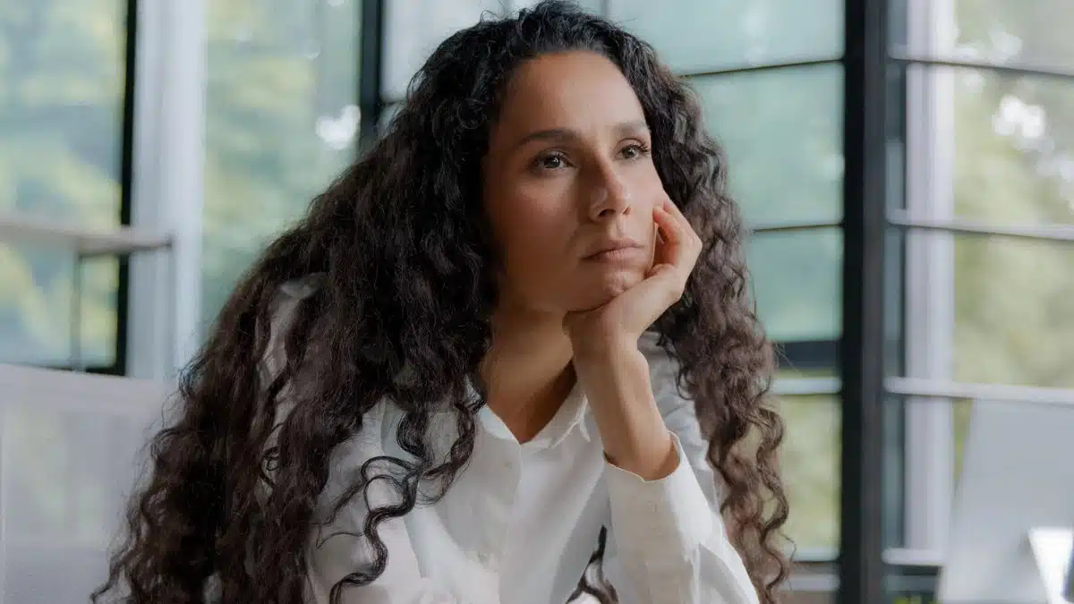woman bored at the office at her desk