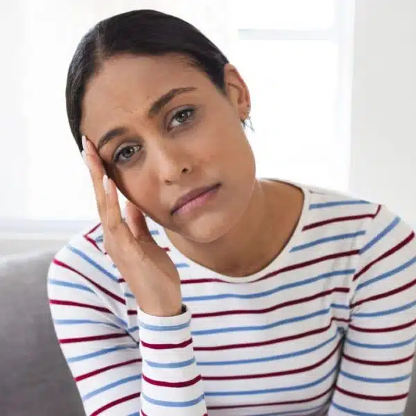 woman confused at home on couch