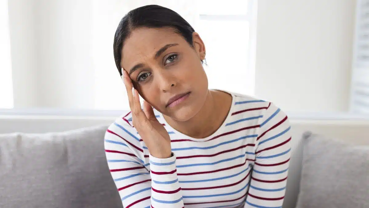 woman confused at home on couch
