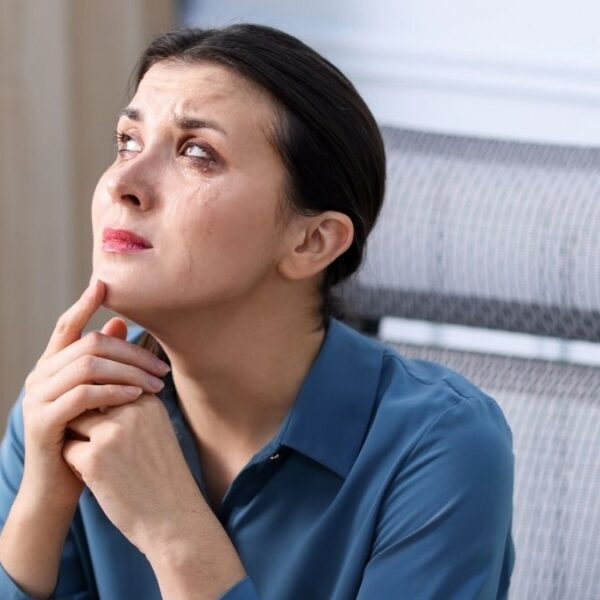 woman crying in her office